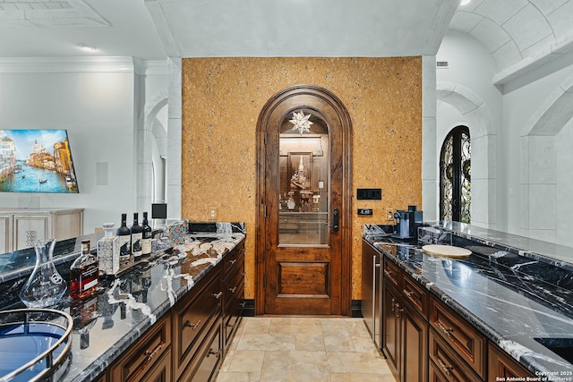 bathroom featuring crown molding and vanity