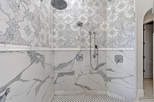 bathroom with tiled shower