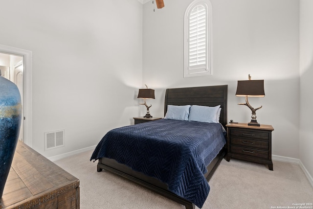 bedroom with light carpet and ceiling fan