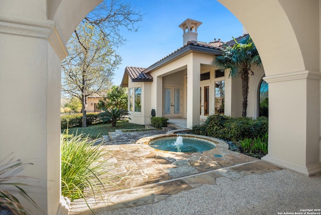 view of pool featuring french doors