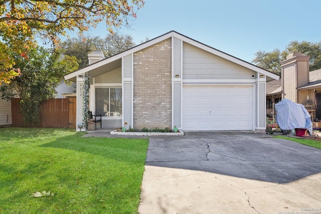 ranch-style house with a garage and a front lawn