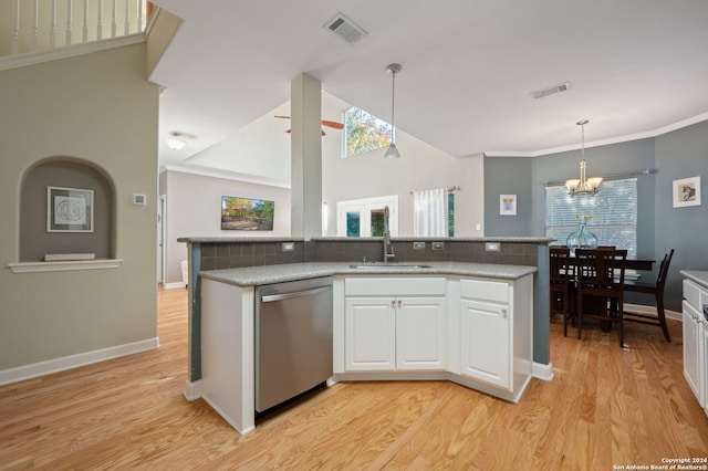 kitchen with white cabinets, dishwasher, pendant lighting, and light stone countertops