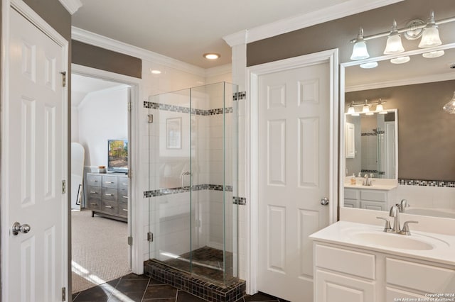 bathroom featuring vanity, tile patterned floors, ornamental molding, and a shower with shower door