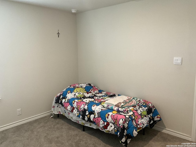 bedroom featuring dark colored carpet