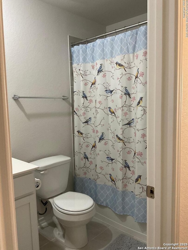 full bathroom with toilet, shower / bath combination with curtain, tile patterned floors, and vanity