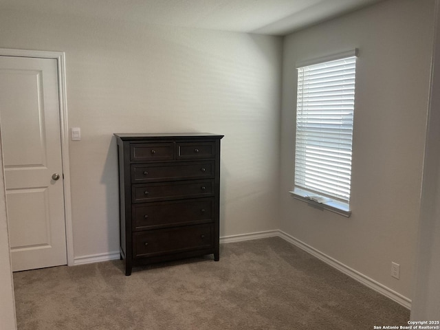 unfurnished bedroom with light colored carpet