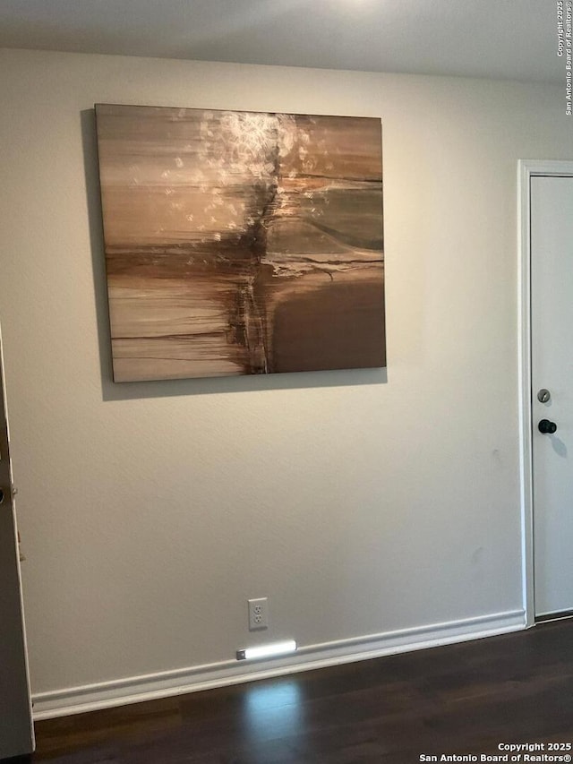 unfurnished room featuring dark hardwood / wood-style floors