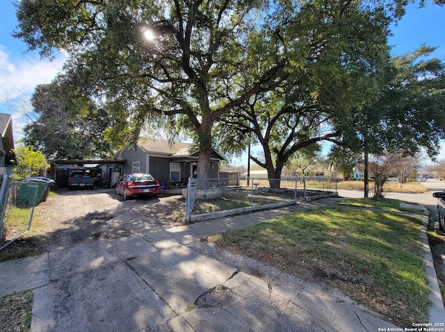 view of front facade with a front yard and a carport