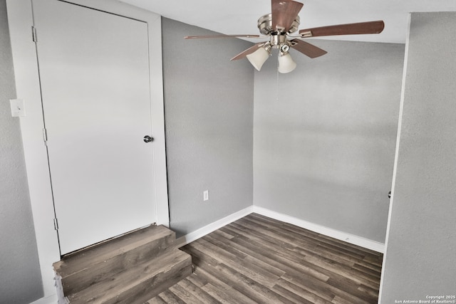 unfurnished room with ceiling fan and dark hardwood / wood-style floors