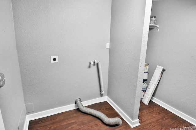 laundry room with electric dryer hookup and wood-type flooring