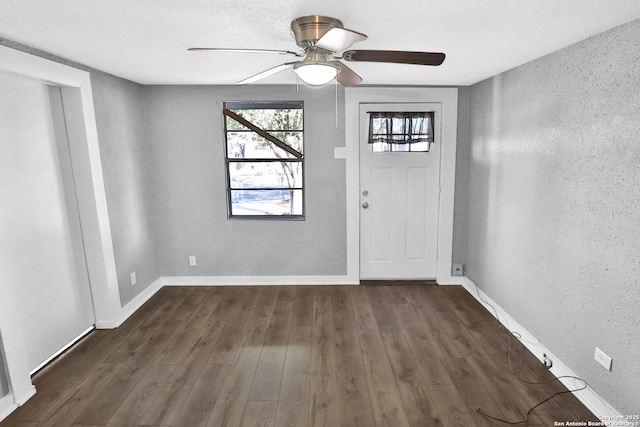 entrance foyer featuring a textured ceiling, dark hardwood / wood-style flooring, and ceiling fan