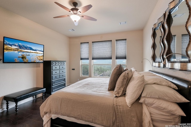 bedroom featuring ceiling fan and dark hardwood / wood-style floors