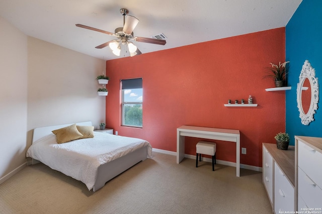 bedroom with light carpet and ceiling fan