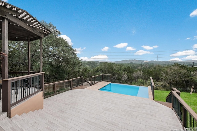 view of pool featuring a patio area and a deck