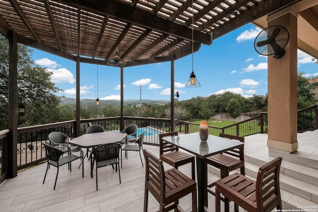 deck featuring a yard, a pergola, and a fenced in pool