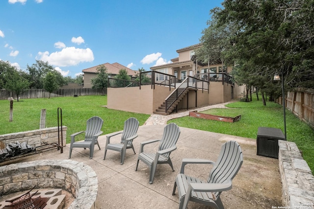 view of patio / terrace with a fire pit