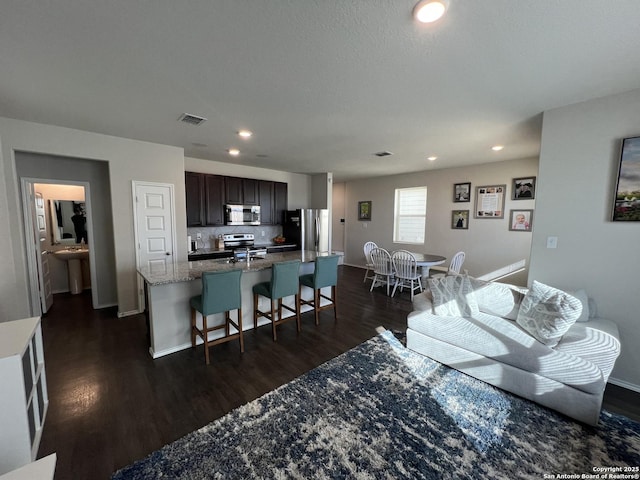 living room with dark wood-type flooring