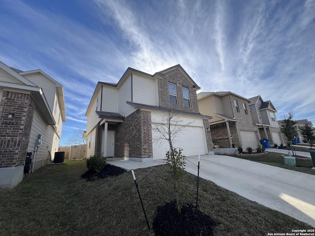 view of front of property featuring central AC unit and a garage