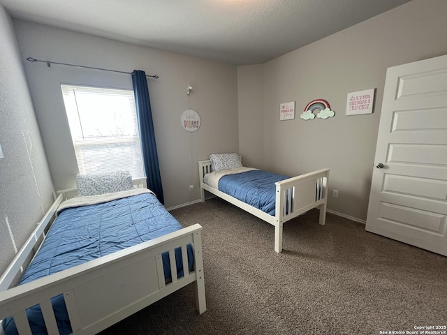 bedroom featuring dark carpet