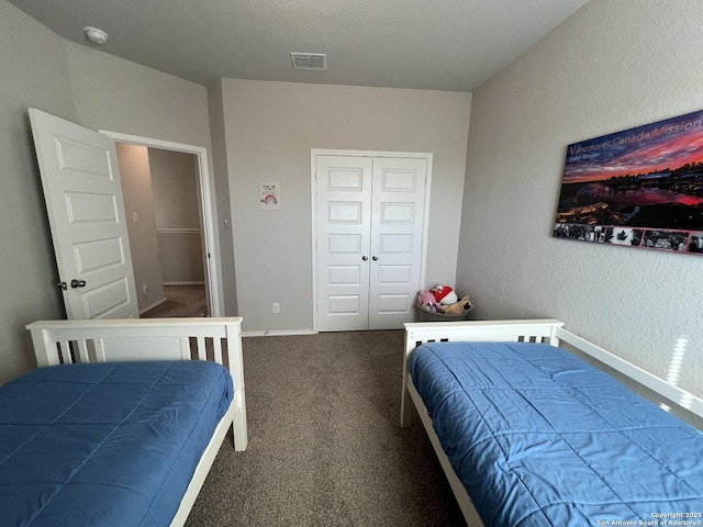 bedroom featuring a closet and carpet