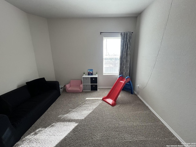 recreation room featuring carpet flooring