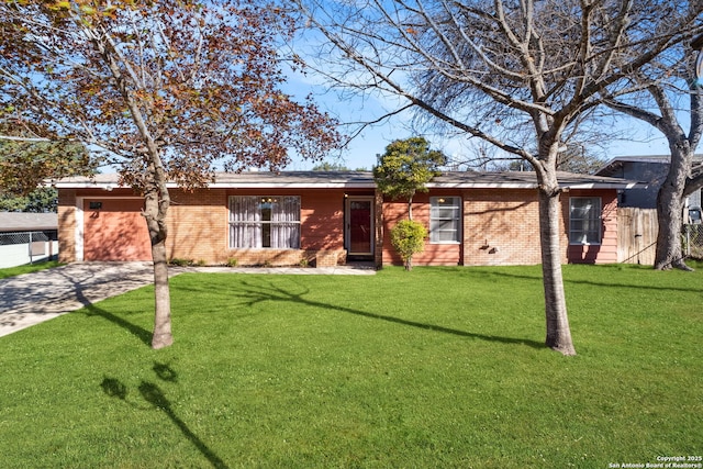 single story home with a front lawn and a garage