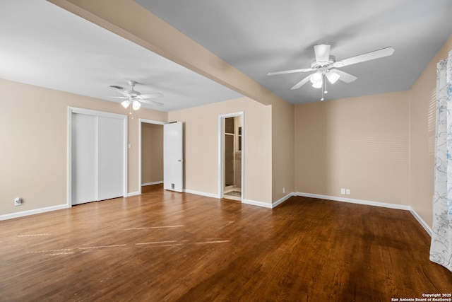 empty room with ceiling fan and hardwood / wood-style floors