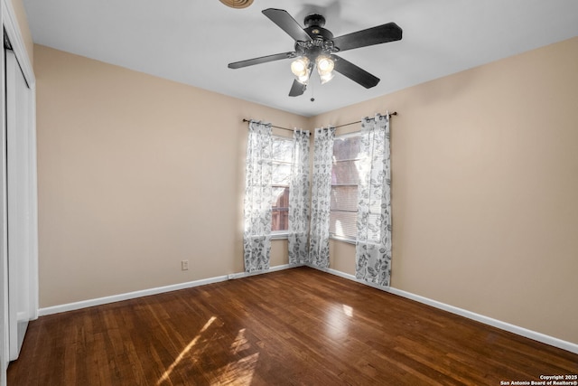 empty room with hardwood / wood-style floors and ceiling fan