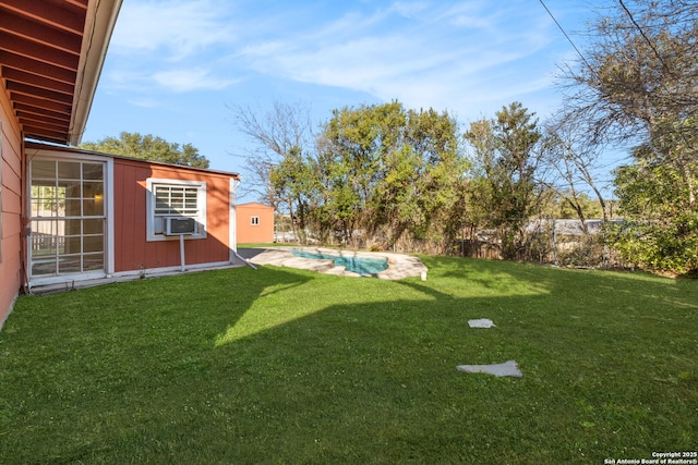 view of yard with cooling unit and an outdoor structure