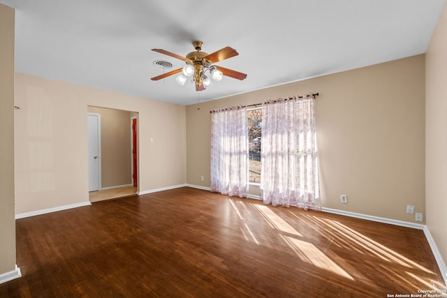 spare room featuring hardwood / wood-style floors and ceiling fan