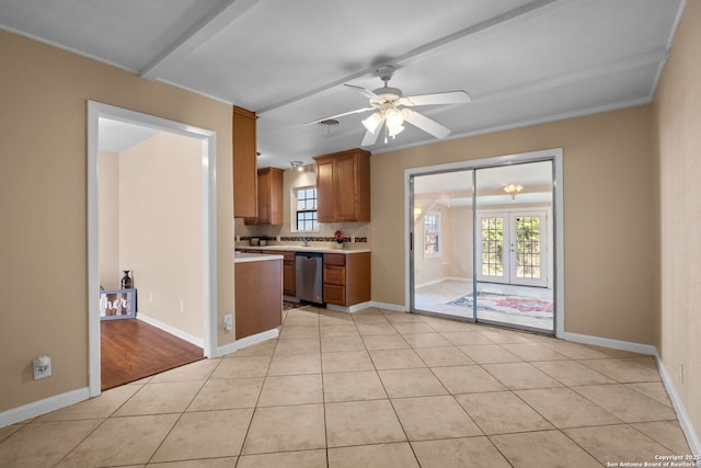 kitchen with dishwasher, crown molding, light tile patterned floors, ceiling fan, and french doors