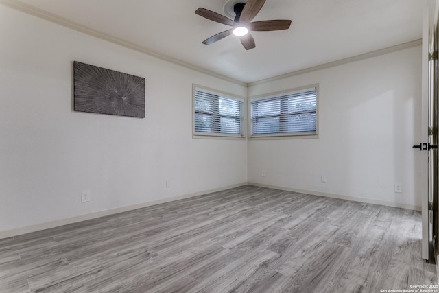 unfurnished room with ceiling fan, crown molding, baseboards, and wood finished floors