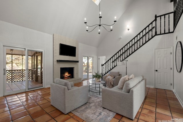 tiled living room featuring a brick fireplace, high vaulted ceiling, and a notable chandelier