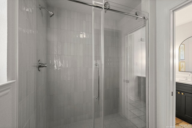 bathroom with an enclosed shower and vanity