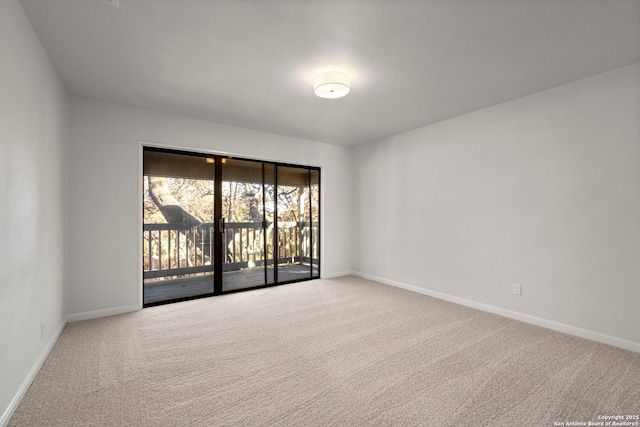 spare room featuring carpet floors