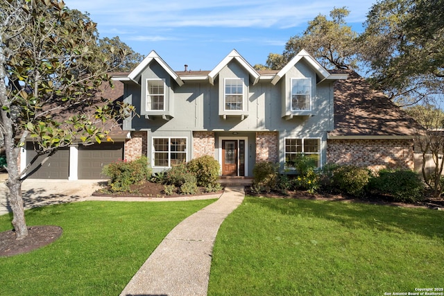 view of front of home with a front yard and a garage