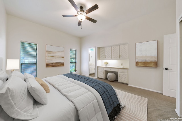 bedroom with multiple windows, light carpet, and ceiling fan