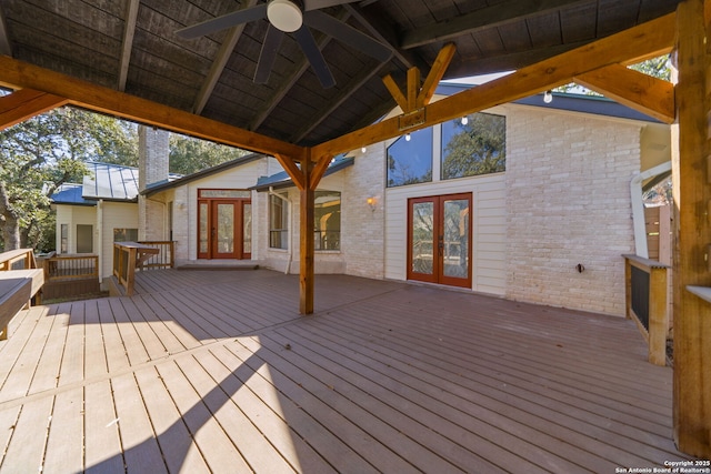 wooden deck with ceiling fan and french doors