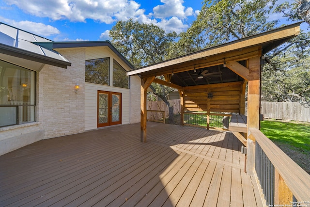 wooden terrace with french doors and ceiling fan