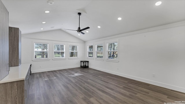 unfurnished living room with ceiling fan, lofted ceiling, and hardwood / wood-style flooring