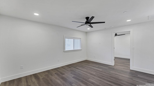 unfurnished room featuring ceiling fan and dark hardwood / wood-style flooring