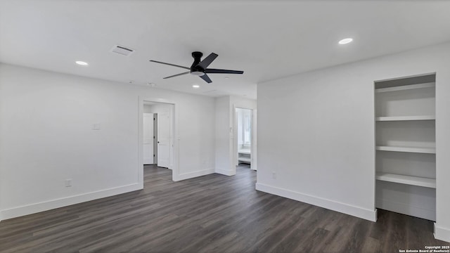 spare room featuring ceiling fan and dark hardwood / wood-style floors