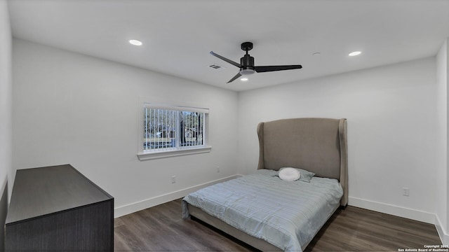 bedroom with ceiling fan and dark wood-type flooring