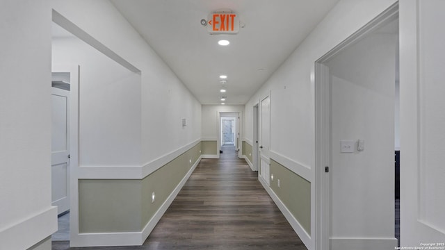 hallway with dark hardwood / wood-style floors