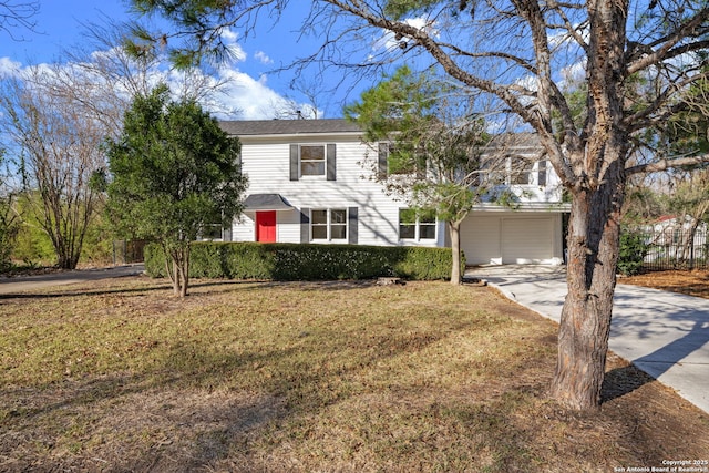 view of front of property featuring a garage and a front lawn