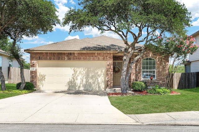 ranch-style home with a front lawn and a garage