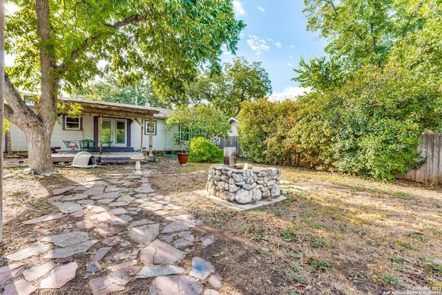 view of yard with a patio area and a wooden deck