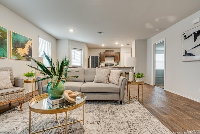 living room with dark hardwood / wood-style flooring