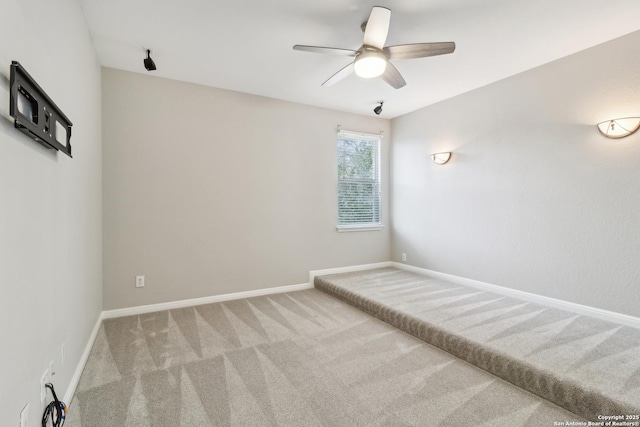 carpeted empty room with ceiling fan