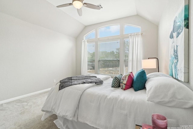 carpeted bedroom with a ceiling fan, lofted ceiling, visible vents, and baseboards